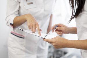 Certified skin specialist checking medical form