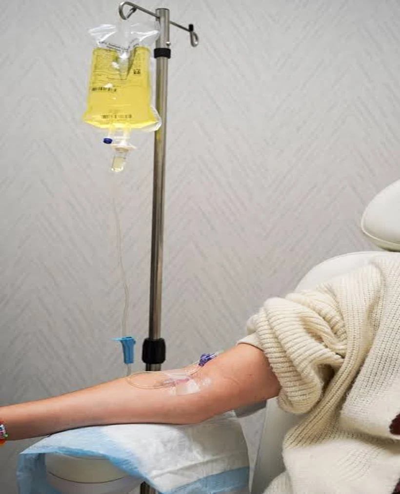 IV drip infusion running into the arm during a session at Aeconic Aesthetic Clinic in Berawa, Canggu, Bali