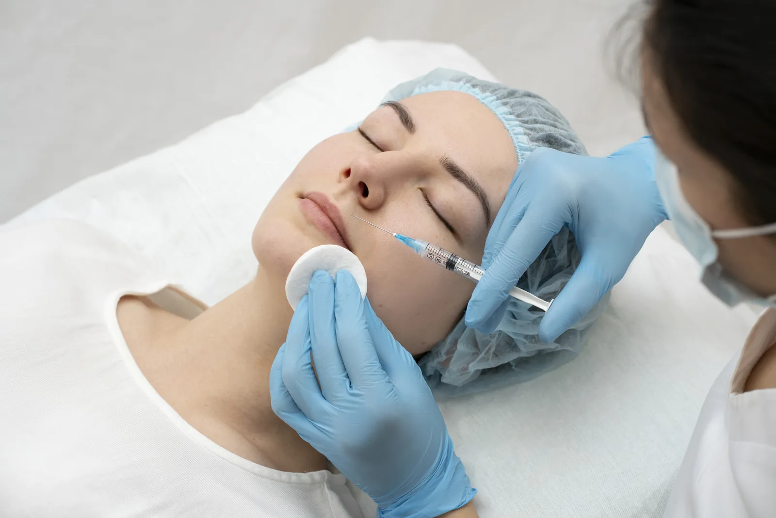 Aesthetic doctor performing a targeted injectable treatment